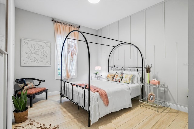 4754 Manning Ct, Sarasota, FL 34240 - bedroom with baseboards and wood finished floors