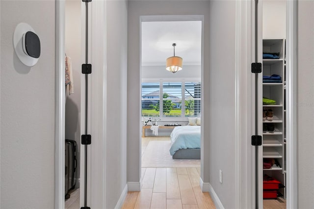 4754 Manning Ct, Sarasota, FL 34240 - hallway featuring baseboards and light wood-style flooring