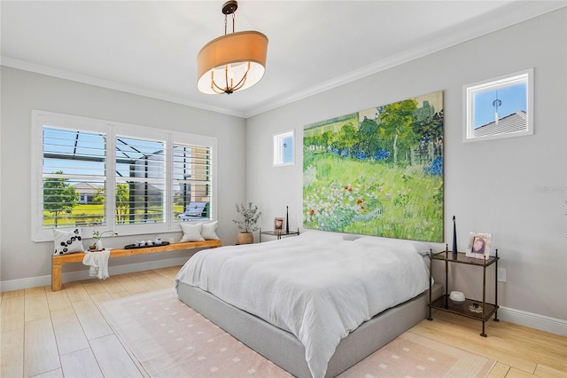 4754 Manning Ct, Sarasota, FL 34240 - bedroom with crown molding, wood finished floors, and baseboards