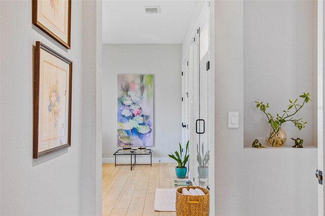 4754 Manning Ct, Sarasota, FL 34240 - corridor with light wood finished floors and baseboards