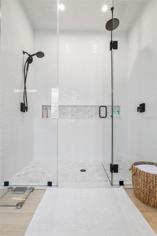 4754 Manning Ct, Sarasota, FL 34240 - bathroom with a shower stall and wood finished floors