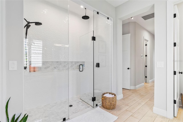 4754 Manning Ct, Sarasota, FL 34240 - full bathroom with a stall shower, wood tiled floors, and baseboards