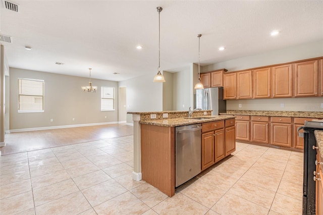 11621 Ashton Field Ave, Riverview, FL 33579 - kitchen featuring appliances with stainless steel finishes, light tile patterned flooring, a chandelier, an island with sink, and light stone counters