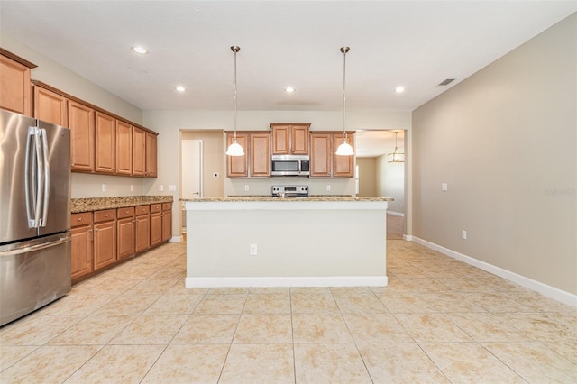 11621 Ashton Field Ave, Riverview, FL 33579 - kitchen with stainless steel appliances, brown cabinets, recessed lighting, light stone countertops, and light tile patterned floors
