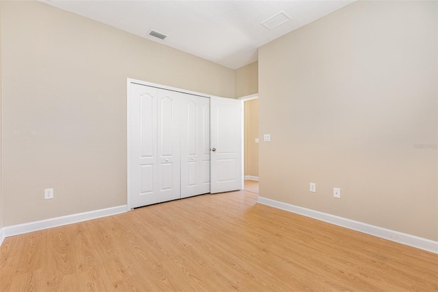 11621 Ashton Field Ave, Riverview, FL 33579 - unfurnished bedroom featuring baseboards, light wood-style flooring, and a closet