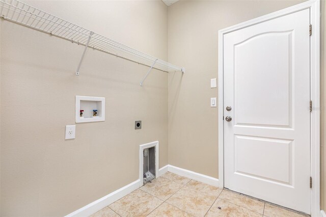 11621 Ashton Field Ave, Riverview, FL 33579 - washroom featuring hookup for a washing machine, electric dryer hookup, baseboards, and light tile patterned floors