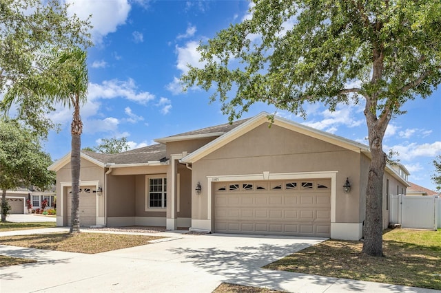 11621 Ashton Field Ave, Riverview, FL 33579 - ranch-style home with a garage, stucco siding, and driveway