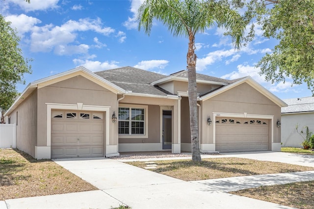 11621 Ashton Field Ave, Riverview, FL 33579 - ranch-style home featuring an attached garage, driveway, stucco siding, and a shingled roof