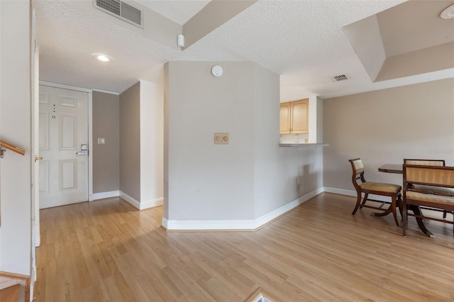 148 Olive Tree Cir Unit 148, Altamonte Springs, FL 32714 - dining space with a textured ceiling, light wood-type flooring, and baseboards