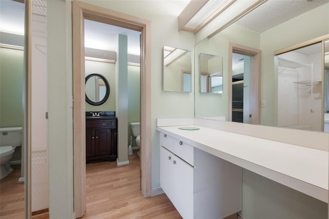 148 Olive Tree Cir Unit 148, Altamonte Springs, FL 32714 - bathroom with toilet, wood finished floors, and vanity