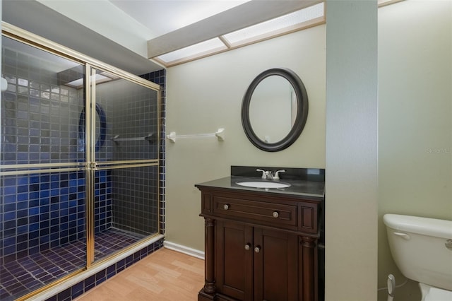 148 Olive Tree Cir Unit 148, Altamonte Springs, FL 32714 - bathroom with a shower stall, toilet, vanity, and wood finished floors