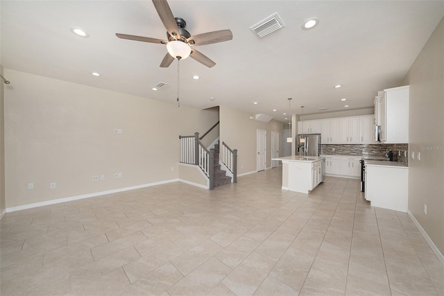 6703 Citrus Creek Ln, Tampa, FL 33625 - unfurnished living room with stairway, a ceiling fan, recessed lighting, baseboards, and light tile patterned floors