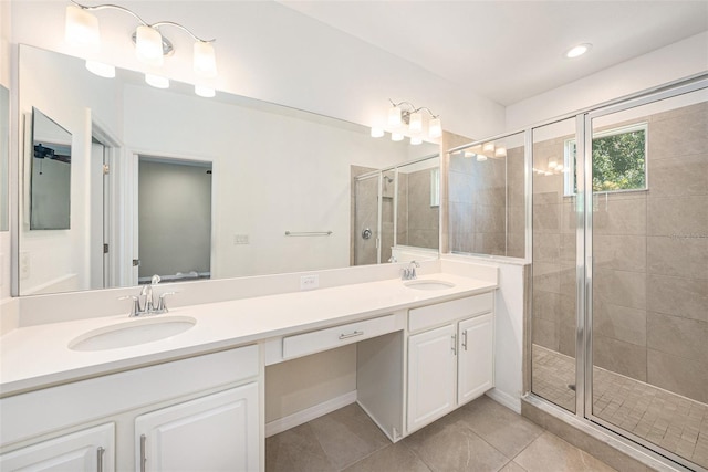 6703 Citrus Creek Ln, Tampa, FL 33625 - bathroom featuring a shower stall, double vanity, tile patterned floors, and recessed lighting
