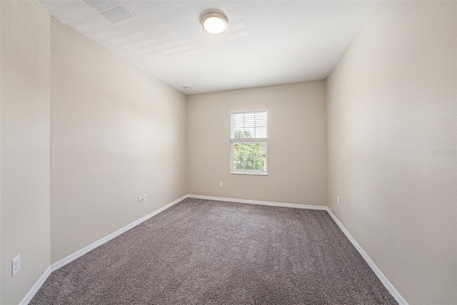 6703 Citrus Creek Ln, Tampa, FL 33625 - spare room featuring carpet flooring and baseboards