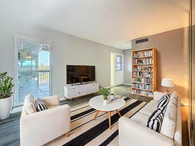 6100 12th St S Unit 313, Saint Petersburg, FL 33705 - living area with wood finished floors and baseboards
