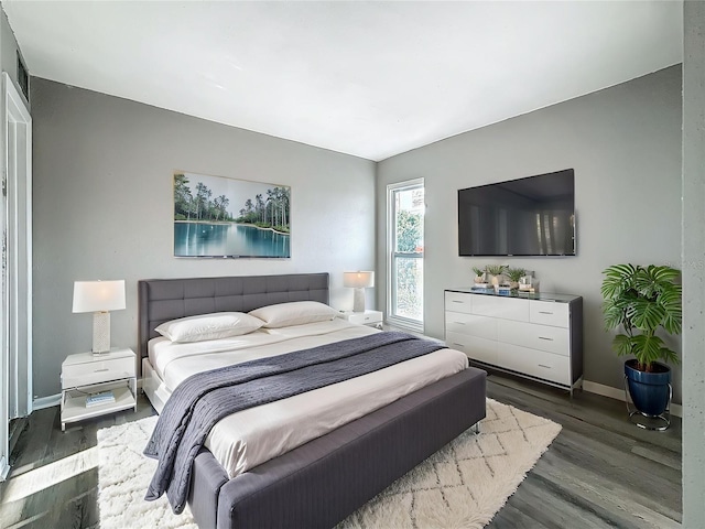 6100 12th St S Unit 313, Saint Petersburg, FL 33705 - bedroom featuring wood finished floors and baseboards