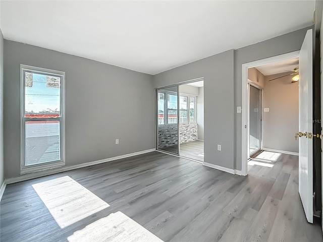 6100 12th St S Unit 313, Saint Petersburg, FL 33705 - unfurnished room featuring wood finished floors and baseboards