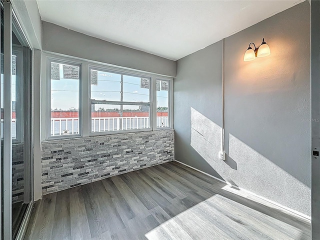 6100 12th St S Unit 313, Saint Petersburg, FL 33705 - spare room with wood finished floors