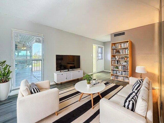 6100 12th St S Unit 313, Saint Petersburg, FL 33705 - living area with wood finished floors and baseboards