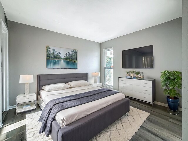 6100 12th St S Unit 313, Saint Petersburg, FL 33705 - bedroom with wood finished floors and baseboards