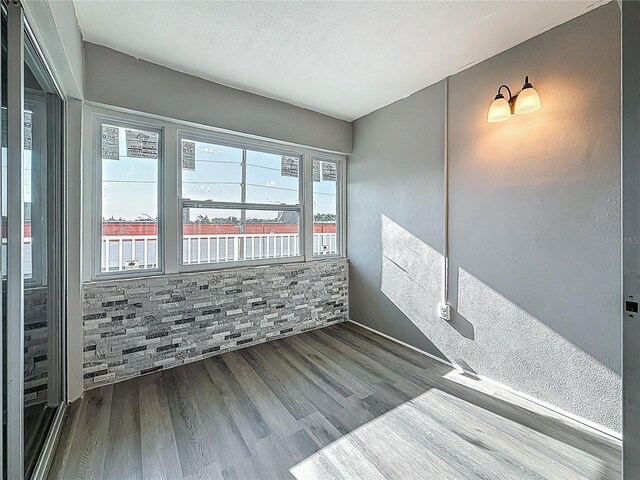 6100 12th St S Unit 313, Saint Petersburg, FL 33705 - empty room featuring wood finished floors