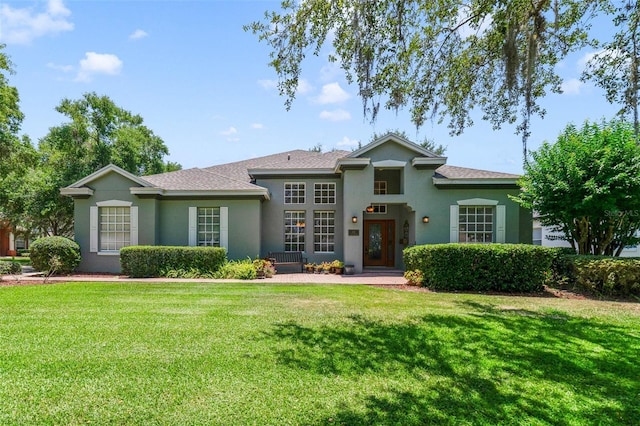 1515 Cherry Lake Way, Lake Mary, FL 32746 - view of front facade with stucco siding and a front lawn