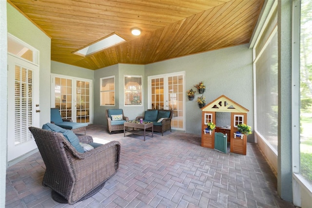 1515 Cherry Lake Way, Lake Mary, FL 32746 - sunroom / solarium with french doors, wood ceiling, a skylight, an outdoor hangout area, and brick flooring