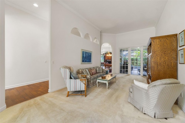 1515 Cherry Lake Way, Lake Mary, FL 32746 - carpeted living area with arched walkways, crown molding, and baseboards