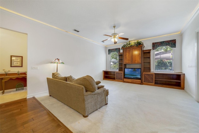 1515 Cherry Lake Way, Lake Mary, FL 32746 - living room featuring crown molding, ceiling fan, light wood finished floors, and baseboards
