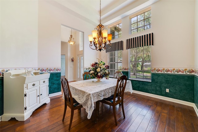 1515 Cherry Lake Way, Lake Mary, FL 32746 - dining space with a wainscoted wall, a chandelier, dark wood-style flooring, a towering ceiling, and baseboards