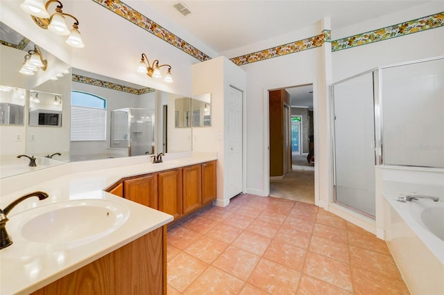 1515 Cherry Lake Way, Lake Mary, FL 32746 - bathroom featuring a shower stall, double vanity, a garden tub, and tile patterned floors