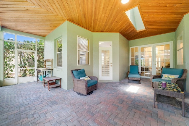 1515 Cherry Lake Way, Lake Mary, FL 32746 - sunroom featuring french doors, wooden ceiling, a skylight, and vaulted ceiling