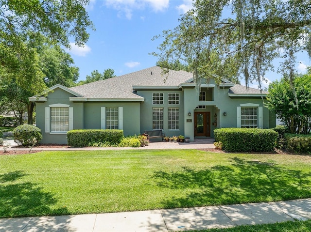 1515 Cherry Lake Way, Lake Mary, FL 32746 - view of front of property with stucco siding, a front yard, and roof with shingles