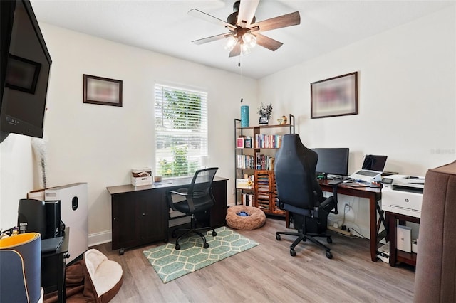 15411 Taurus Ct, Mascotte, FL 34753 - office area with wood finished floors, ceiling fan, and baseboards