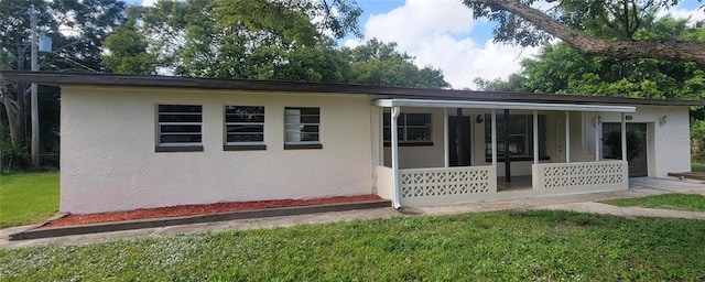 1107 Greenwood Way, Cocoa, FL 32922 - view of front of home featuring stucco siding and a front lawn