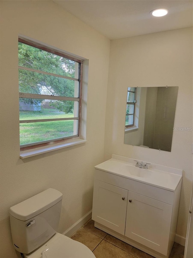 1107 Greenwood Way, Cocoa, FL 32922 - bathroom with toilet, vanity, tile patterned floors, and baseboards