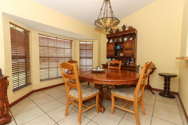 3939 Magnolia Lake Ln, Orlando, FL 32810 - dining space with baseboards and light tile patterned flooring