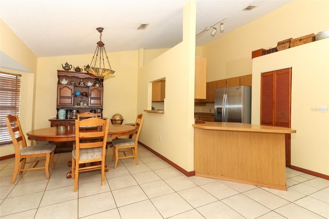 3939 Magnolia Lake Ln, Orlando, FL 32810 - dining area with baseboards and vaulted ceiling