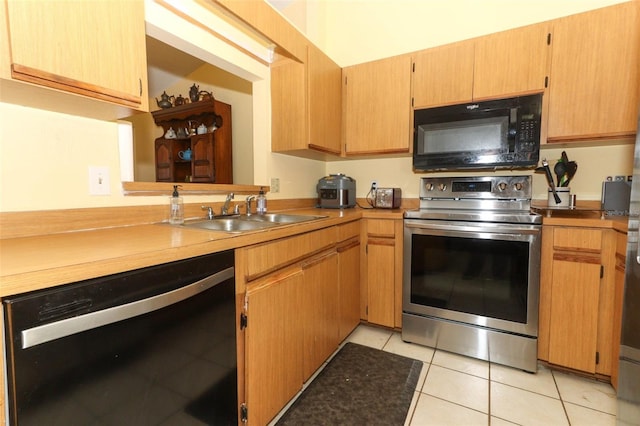 3939 Magnolia Lake Ln, Orlando, FL 32810 - kitchen featuring black appliances, a sink, light tile patterned floors, and light countertops