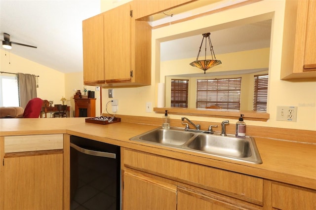 3939 Magnolia Lake Ln, Orlando, FL 32810 - kitchen featuring a sink, light countertops, dishwashing machine, a peninsula, and a ceiling fan