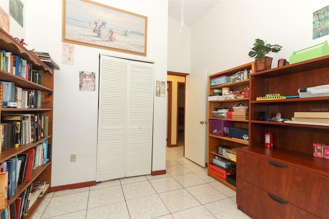 3939 Magnolia Lake Ln, Orlando, FL 32810 - office space featuring light tile patterned floors, high vaulted ceiling, and baseboards