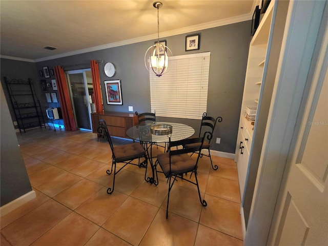 663 68th Ave S, Saint Petersburg, FL 33705 - dining space with light tile patterned floors, a chandelier, crown molding, and baseboards