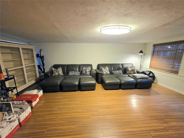 663 68th Ave S, Saint Petersburg, FL 33705 - living room featuring wood finished floors and a textured ceiling