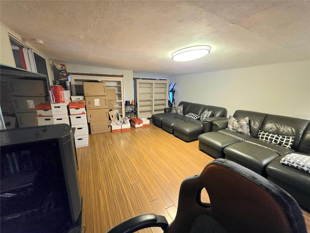663 68th Ave S, Saint Petersburg, FL 33705 - living room with a textured ceiling and wood finished floors