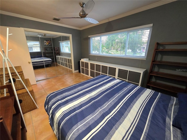 663 68th Ave S, Saint Petersburg, FL 33705 - bedroom featuring light tile patterned floors, crown molding, and a ceiling fan