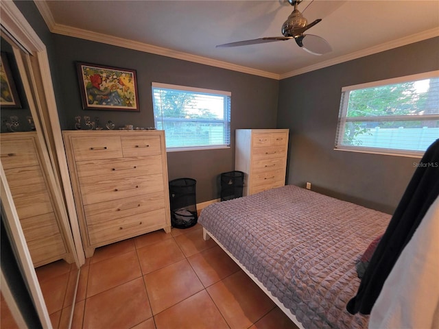 663 68th Ave S, Saint Petersburg, FL 33705 - bedroom with multiple windows, light tile patterned floors, ornamental molding, and a ceiling fan