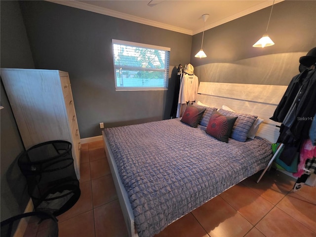 663 68th Ave S, Saint Petersburg, FL 33705 - bedroom featuring tile patterned floors, ornamental molding, and baseboards