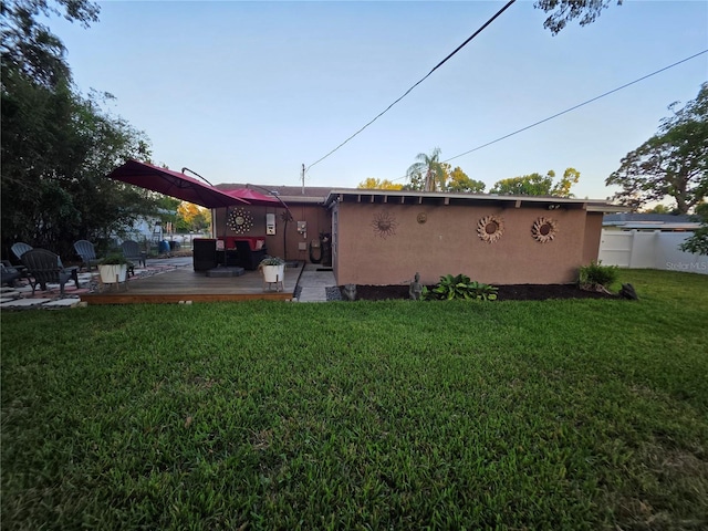 663 68th Ave S, Saint Petersburg, FL 33705 - rear view of house with a deck and stucco siding