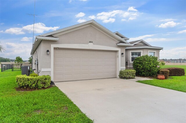1805 Kingsmill Dr, Bartow, FL 33830 - ranch-style house with stucco siding, an attached garage, and concrete driveway