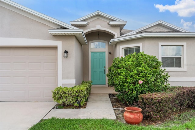 1805 Kingsmill Dr, Bartow, FL 33830 - view of exterior entry featuring stucco siding and an attached garage
